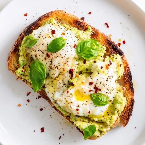 Warm Avocado Mozzarella Tartine with melted cheese and fresh avocado on crispy bread, ready for a quick lunch.  
