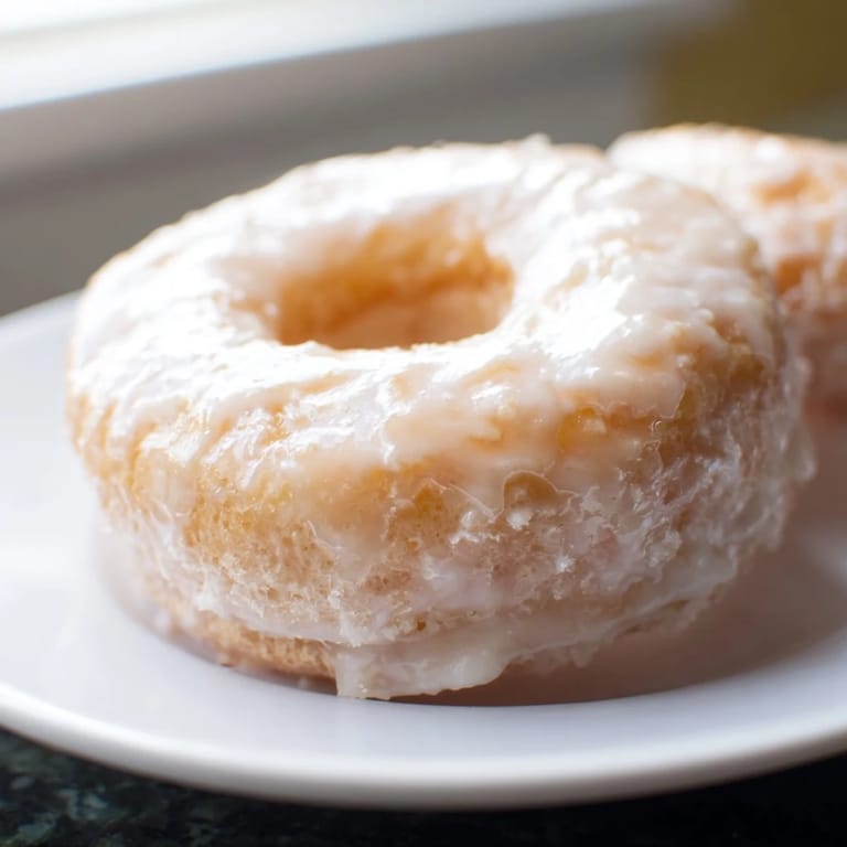 Warm, sugared cake donuts with a soft, cake-like center, perfect for breakfast treats.