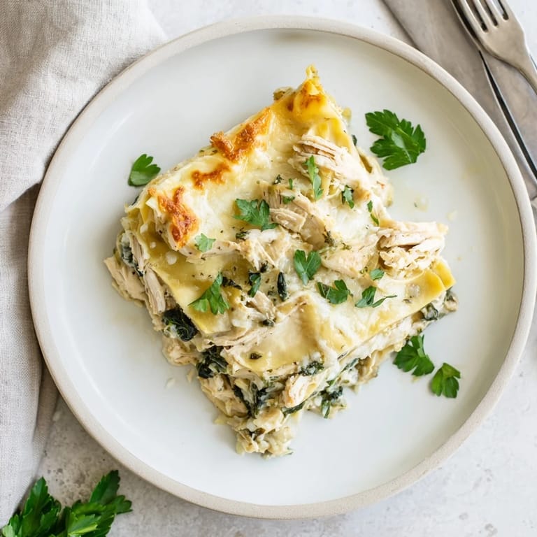 Fresh spinach and tender chicken layered between pasta sheets, covered in bubbling Alfredo and melted mozzarella.  