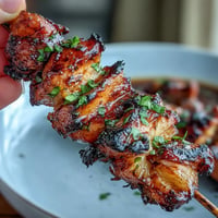 Juicy grilled chicken al pastor skewers with caramelized pineapple rings.